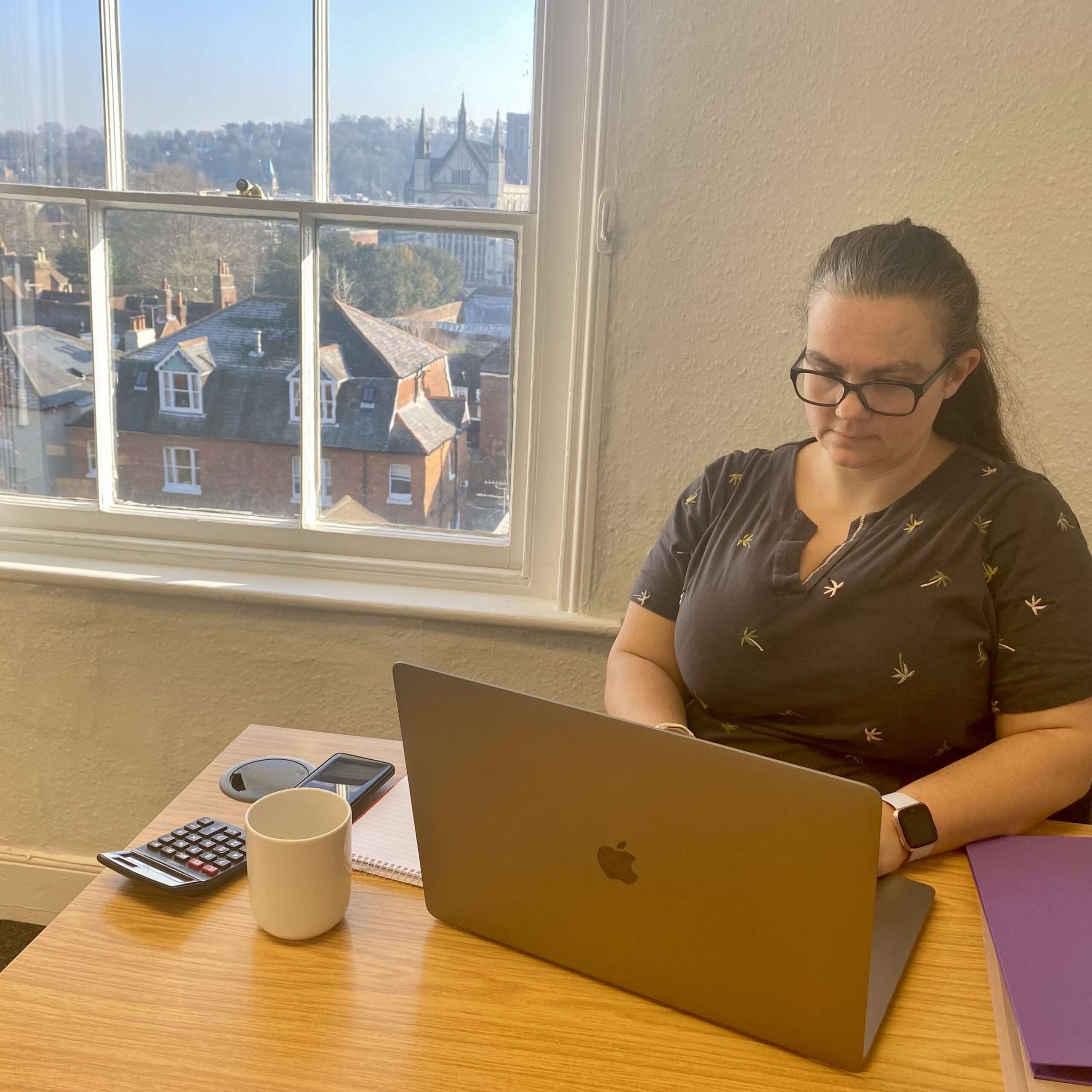 Woman working at desk in serviced office at Hampshire Workspace in Winchester UK